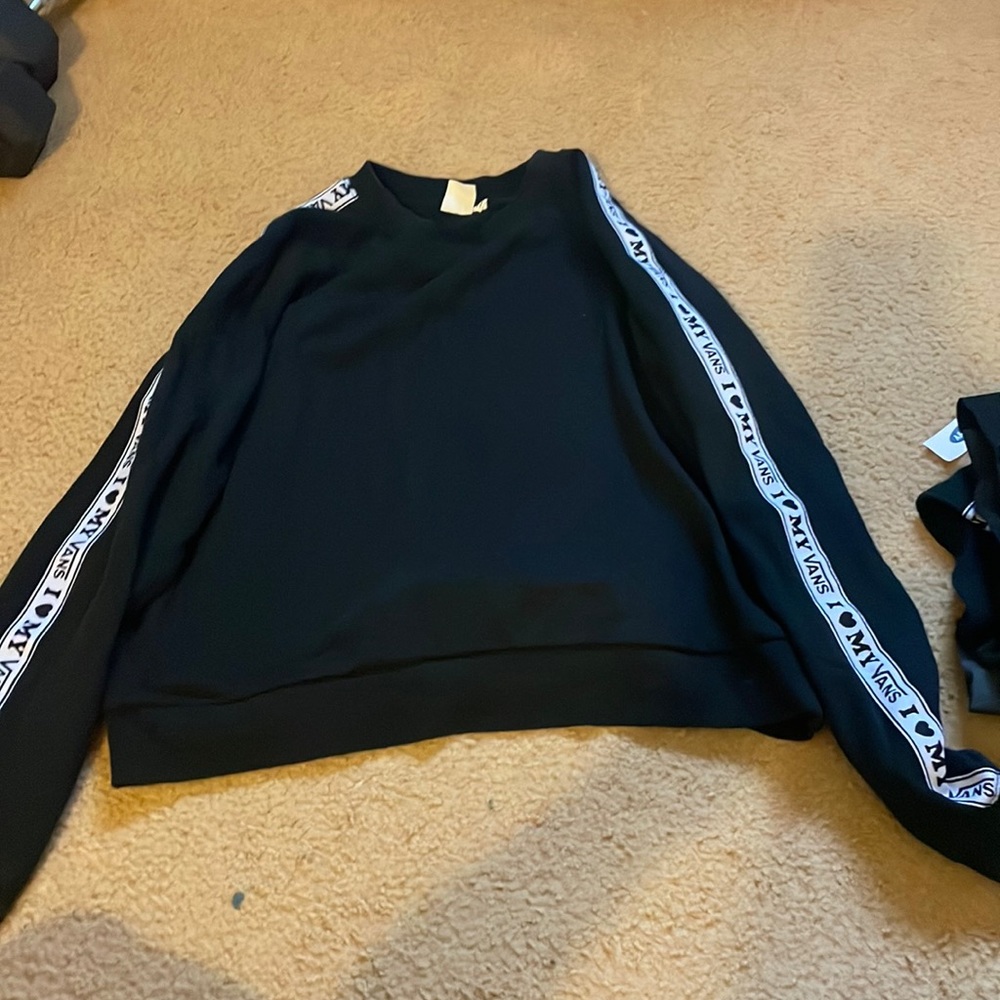 Matching sweatshirt to a shorts sweat set.